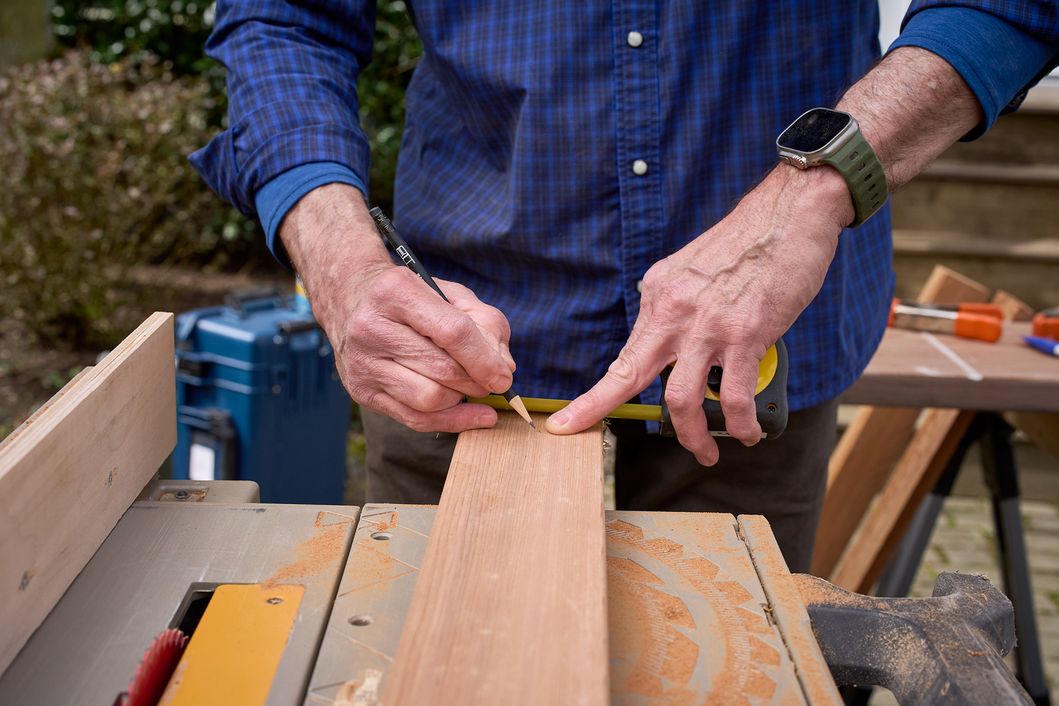 Craftsman measuring for a precise cut
