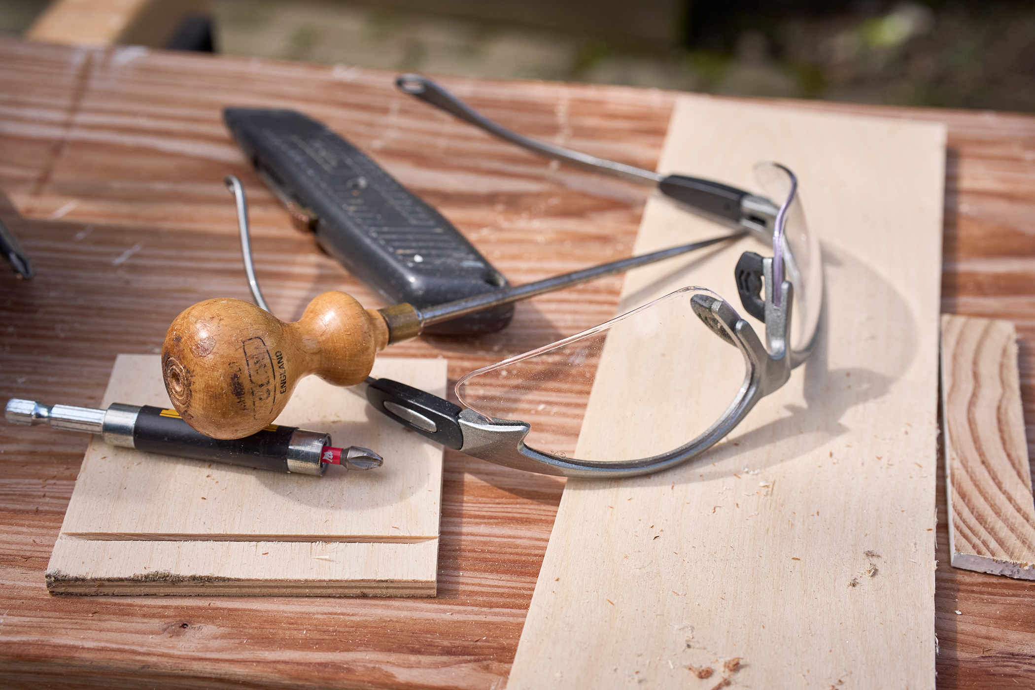 Craftsman tools laid out on a workbench